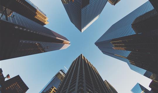 Ground level shot of big skyscrapers representing corporate insurance