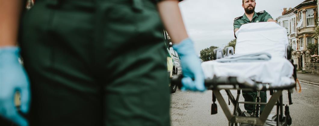 Two ambulance drivers at the scene of a road traffic accident